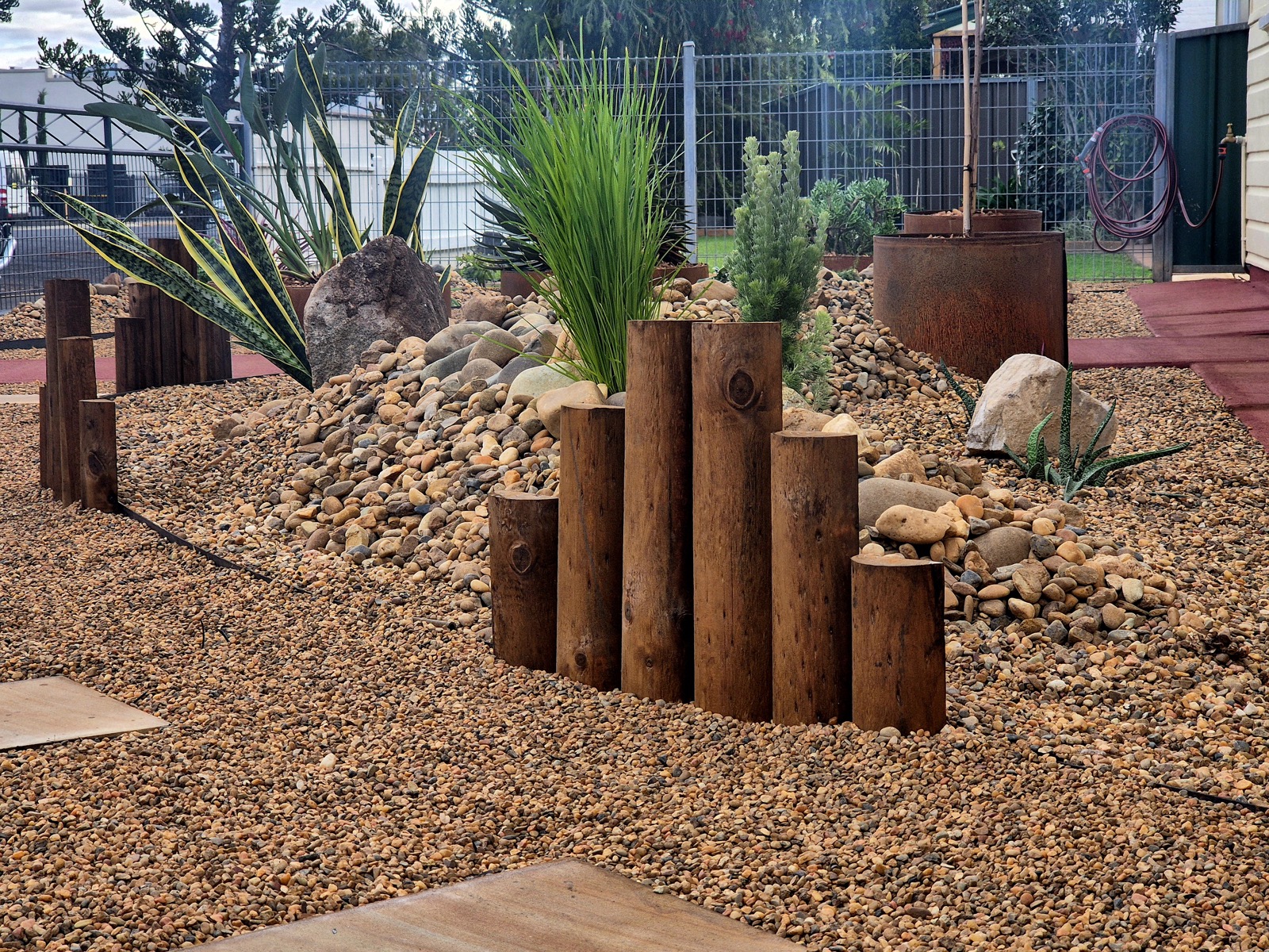 A designed water-smart garden with feature planting by MR Landscapes near Dubbo