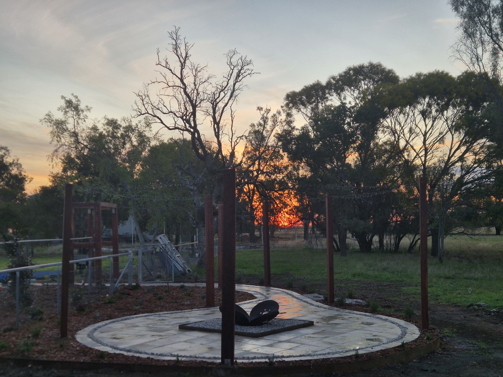 A firepit area at sunset by MR Landscapes