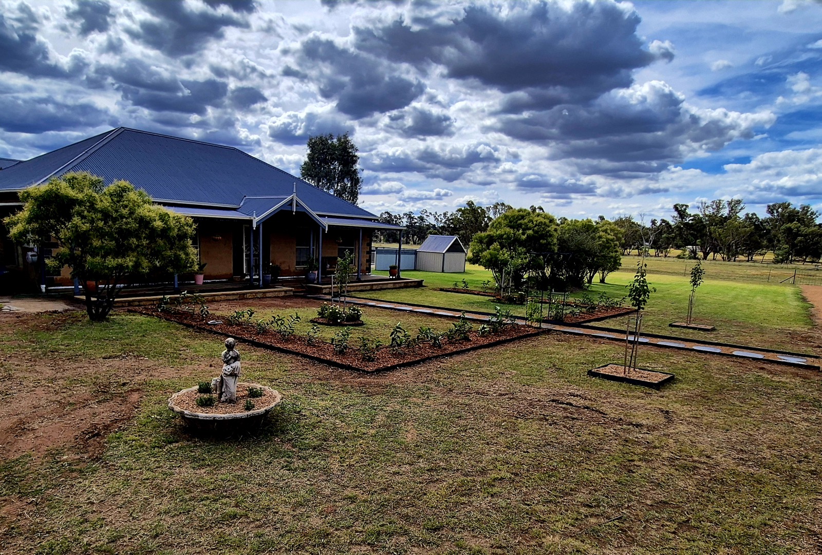 A landscaped rural property and lawn by MR Landscapes