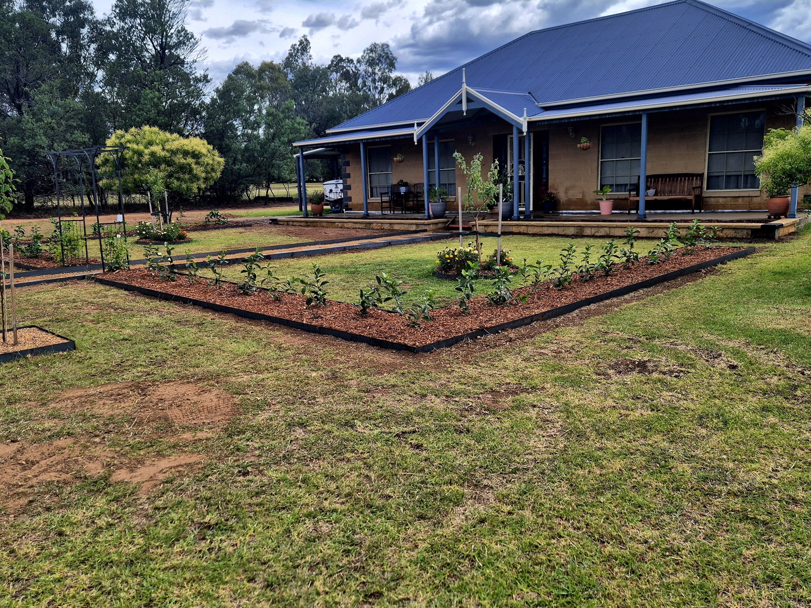 A landscaped homestead garden and lawn by MR Landscapes