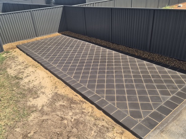 A paved path and driveway by MR Landscapes