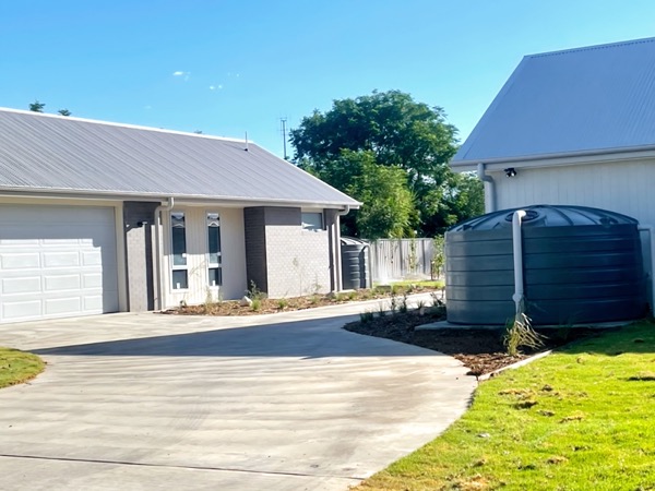 A driveway and landscaped garden by MR Landscapes