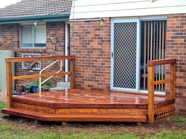 A timber deck and outdoor living area by MR Landscapes