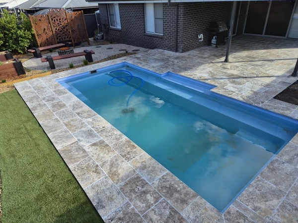 A pool surround and paving by MR Landscapes
