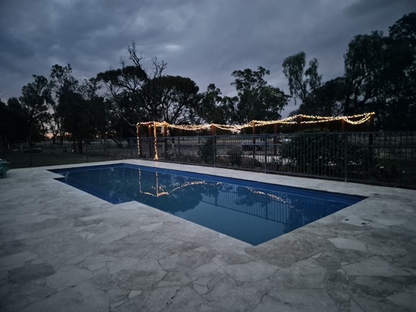 A landscaped pool area by MR Landscapes