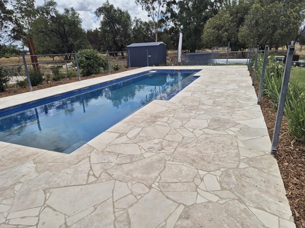 A paved pool surround by MR Landscapes