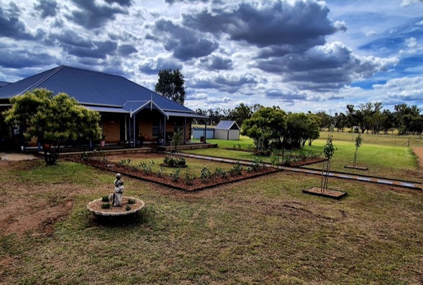 A landscaped rural property and lawn by MR Landscapes