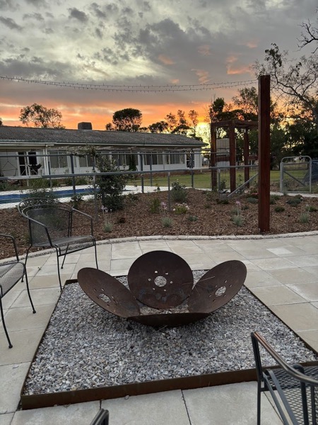 A firepit ring set in a pebble garden by MR Landscapes